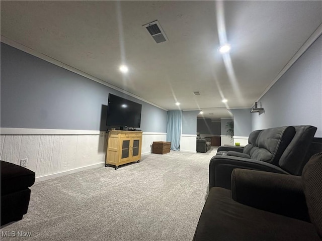 carpeted living room with crown molding