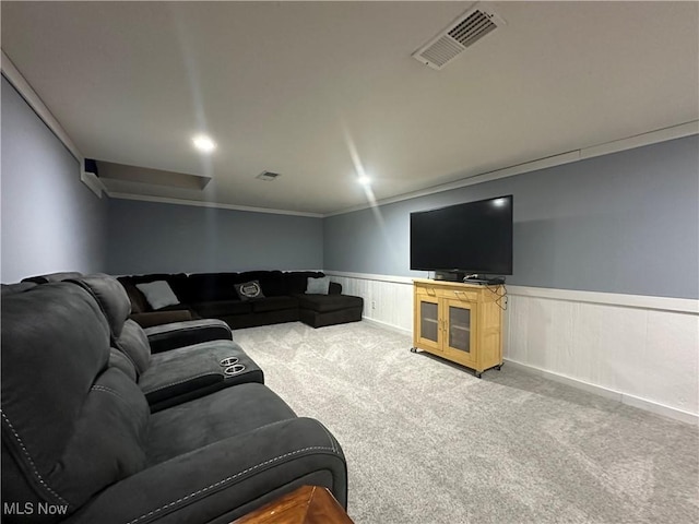 carpeted living room featuring ornamental molding