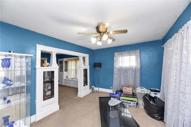 interior space featuring ceiling fan