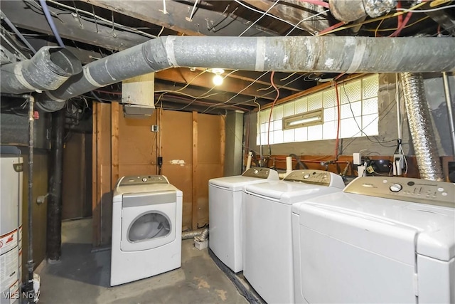 washroom with gas water heater and independent washer and dryer