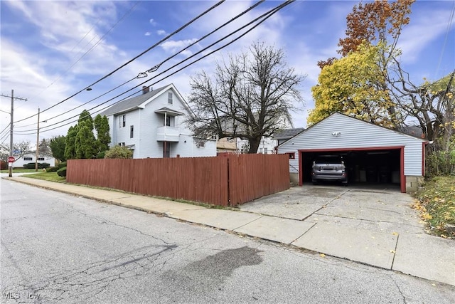 view of home's exterior with an outdoor structure and a garage