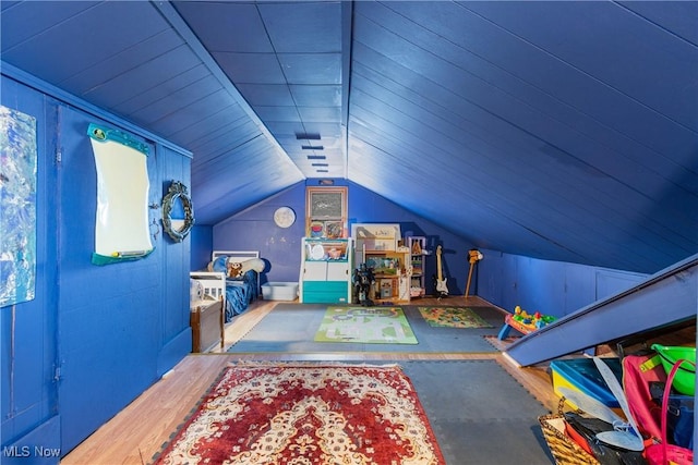 playroom with vaulted ceiling and hardwood / wood-style flooring