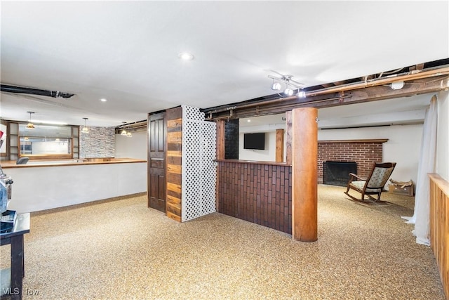 living room with carpet flooring and a brick fireplace