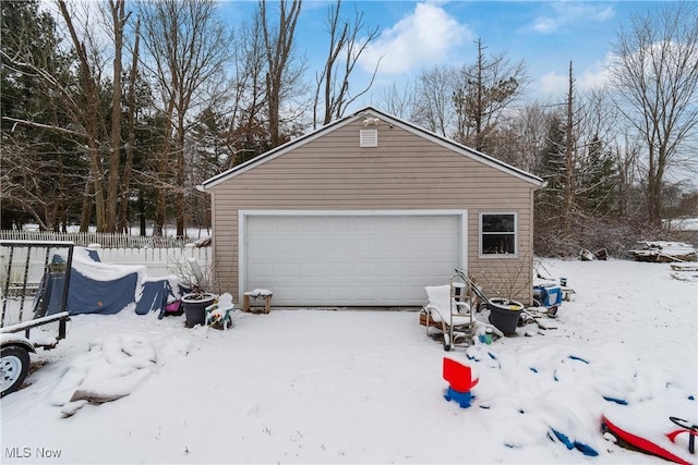 view of snow covered garage