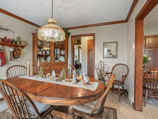 tiled dining room with a notable chandelier and crown molding