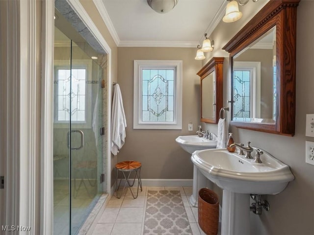 bathroom with tile patterned flooring, an enclosed shower, plenty of natural light, crown molding, and double sink