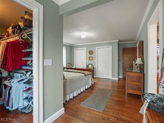 bedroom featuring crown molding and hardwood / wood-style floors