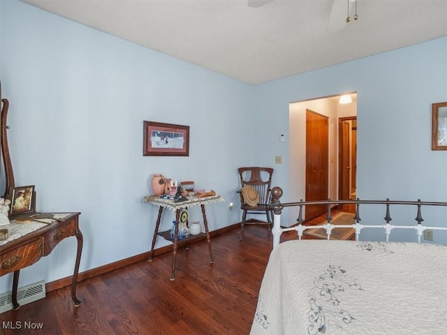 bedroom with dark wood-type flooring and ceiling fan