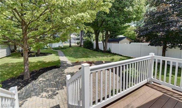 deck featuring a lawn and a patio