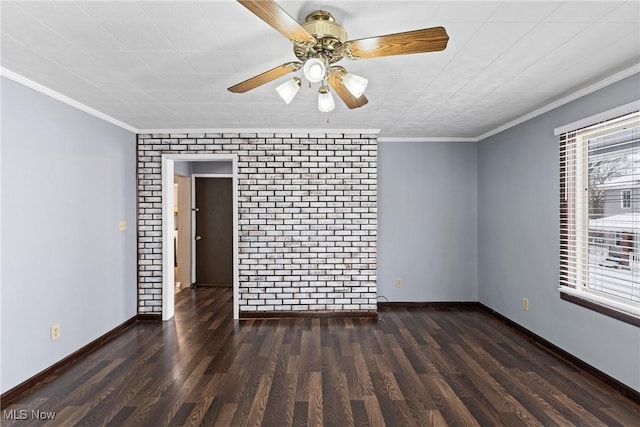 unfurnished room featuring a wealth of natural light, dark wood-type flooring, brick wall, and ornamental molding