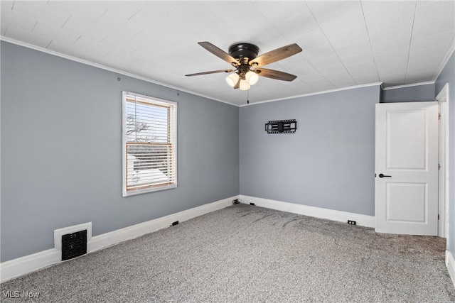 carpeted empty room featuring crown molding and ceiling fan