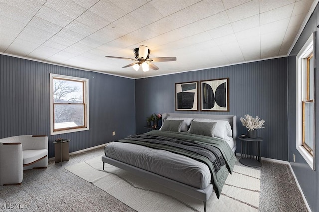 bedroom featuring light colored carpet, ceiling fan, and ornamental molding