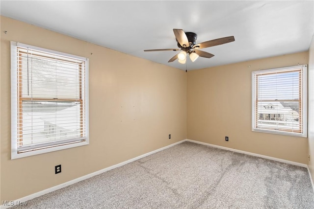 unfurnished room with carpet flooring and ceiling fan