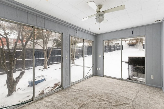 interior space featuring ceiling fan