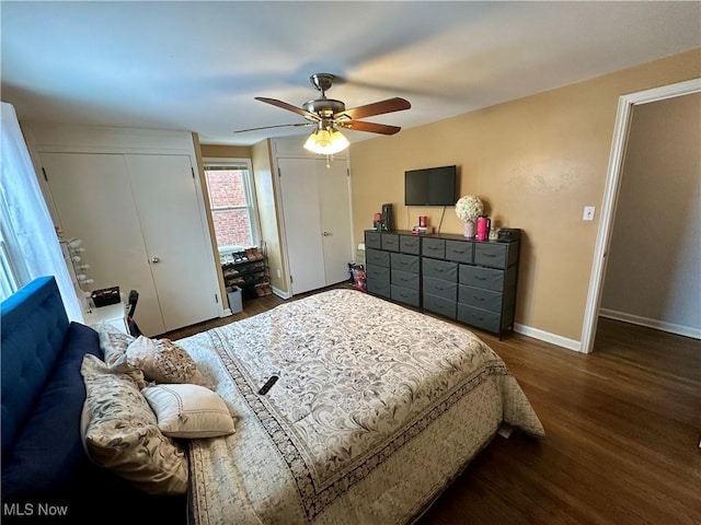 bedroom with ceiling fan and dark hardwood / wood-style floors