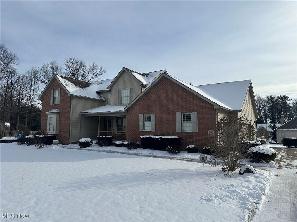 view of snow covered property