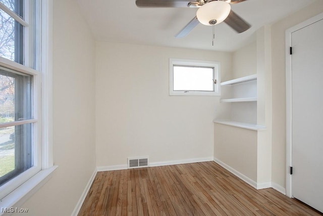 spare room with ceiling fan and light hardwood / wood-style flooring