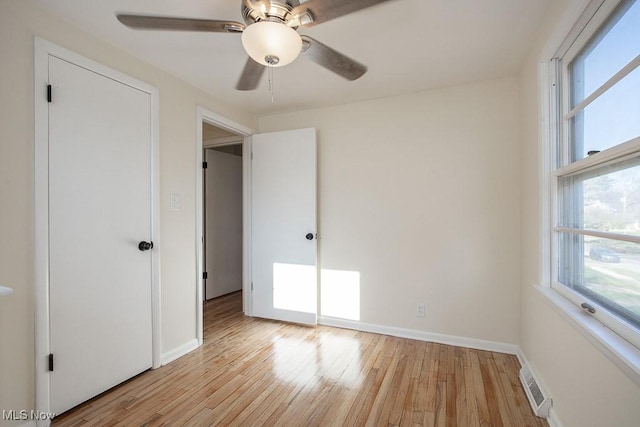 unfurnished bedroom featuring ceiling fan and light wood-type flooring