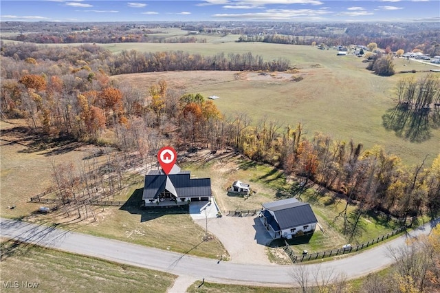 birds eye view of property with a rural view