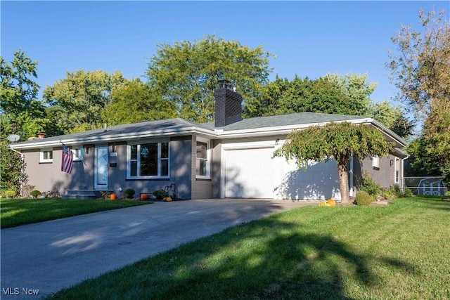 ranch-style house featuring a garage and a front lawn