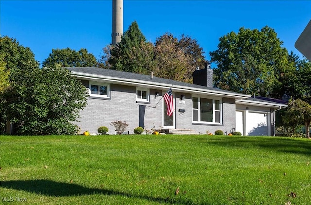 single story home with a garage and a front yard