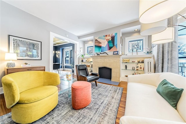 living room with radiator heating unit and hardwood / wood-style flooring