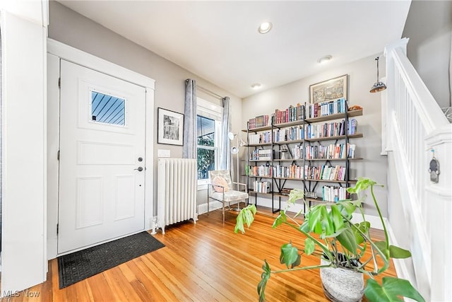 entryway featuring radiator and hardwood / wood-style floors