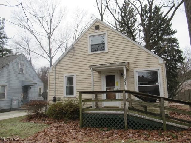 rear view of house featuring a deck