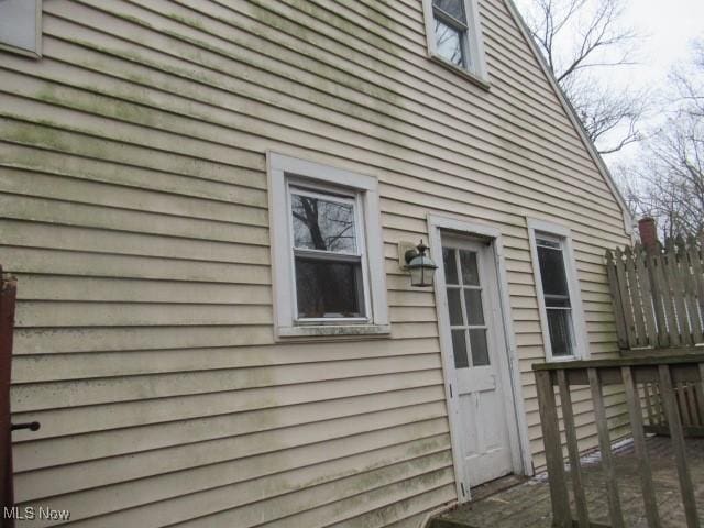 view of side of property with a deck