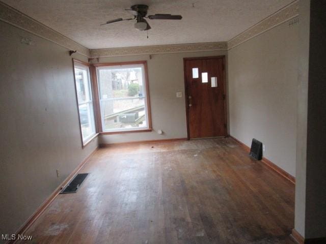 entryway with hardwood / wood-style flooring and ceiling fan