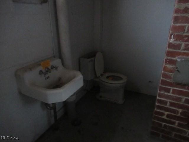 bathroom with toilet and sink