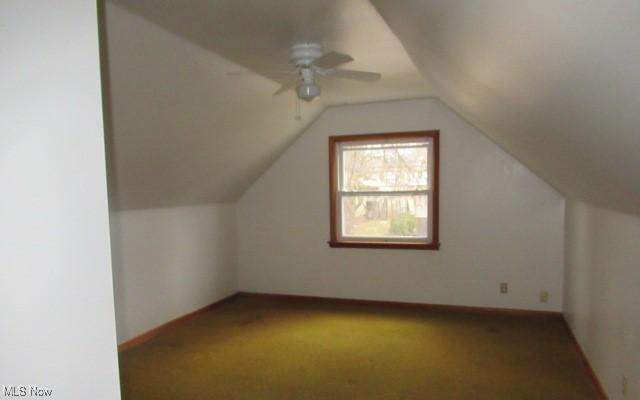 bonus room with carpet flooring, ceiling fan, and vaulted ceiling