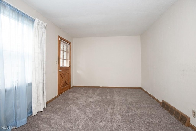 empty room with carpet flooring