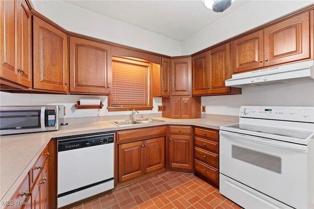 kitchen with white appliances and sink