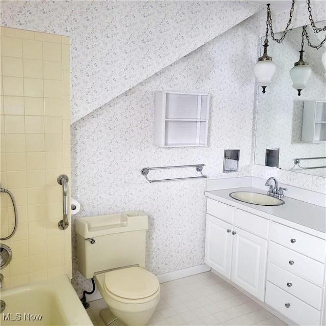 bathroom featuring toilet, vanity, and tile patterned floors