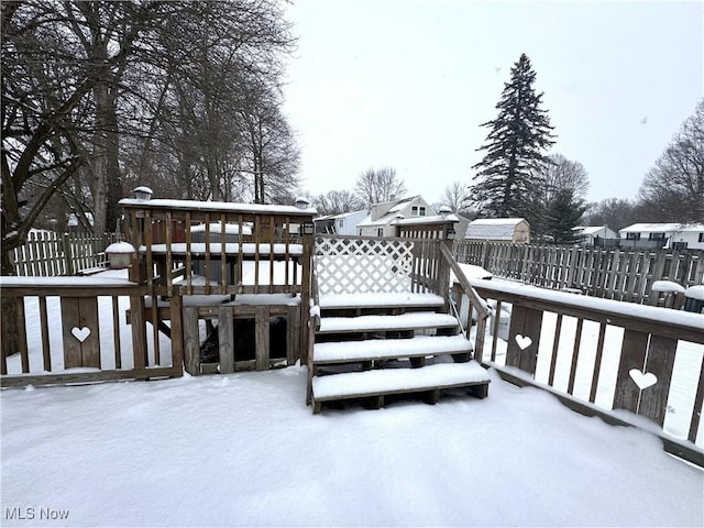 view of snow covered deck