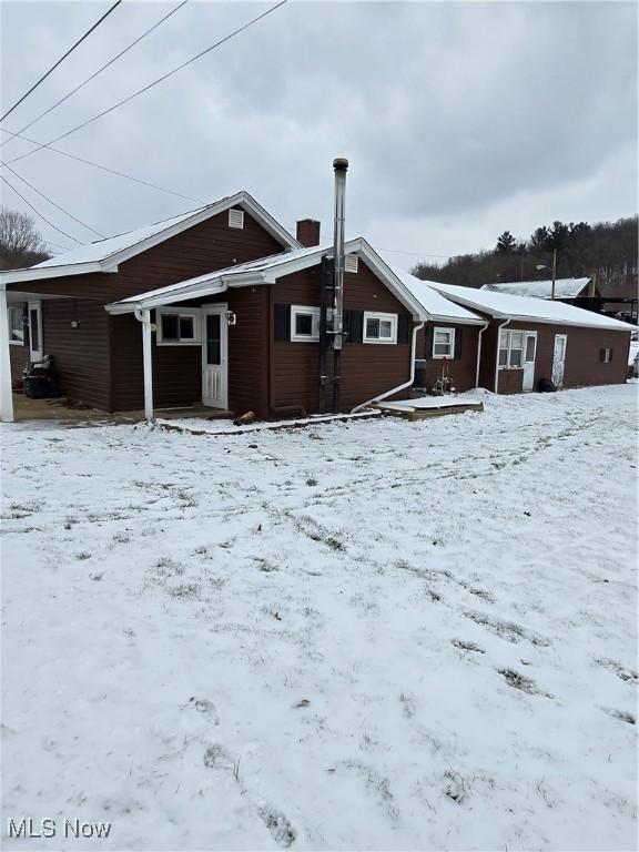 view of snow covered house