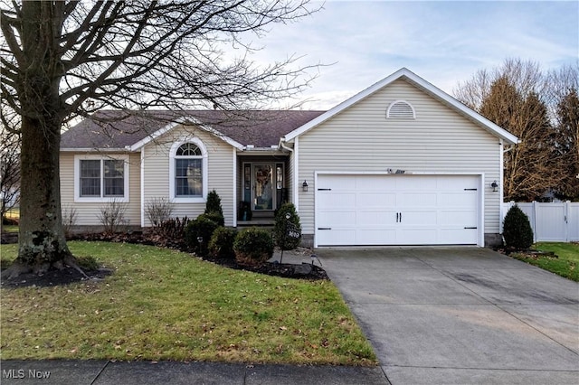 ranch-style home with a front lawn and a garage