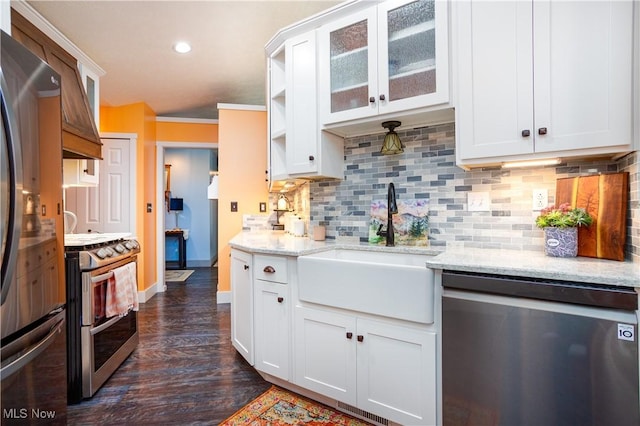 kitchen featuring white cabinetry, sink, and appliances with stainless steel finishes