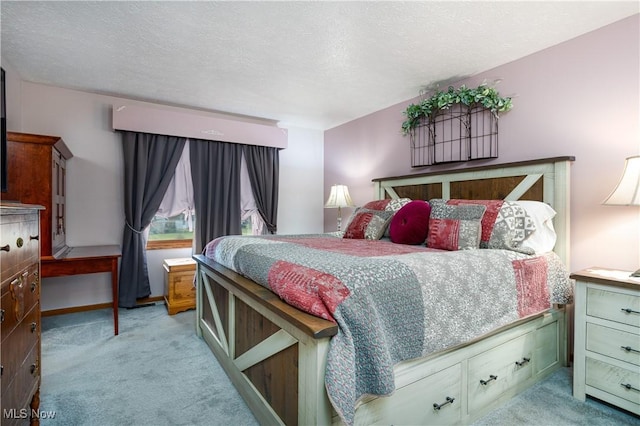 carpeted bedroom with a textured ceiling