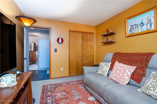 living room with light carpet and a textured ceiling