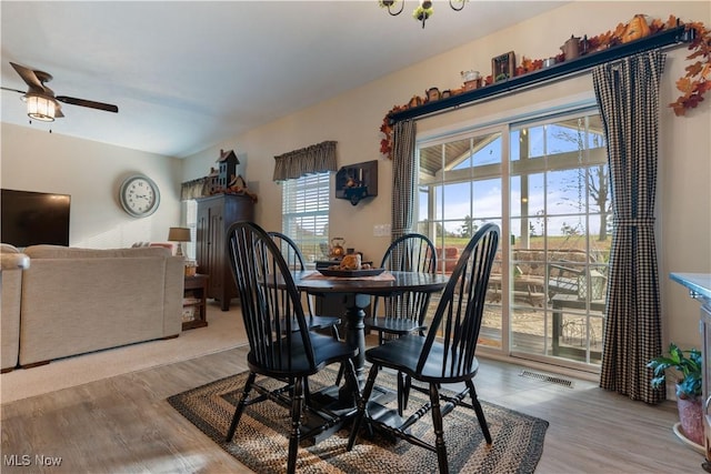 dining area featuring ceiling fan and light wood-type flooring