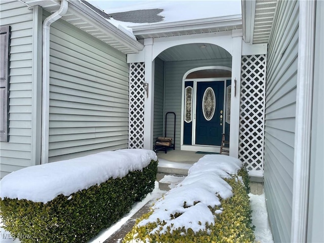 view of snow covered property entrance