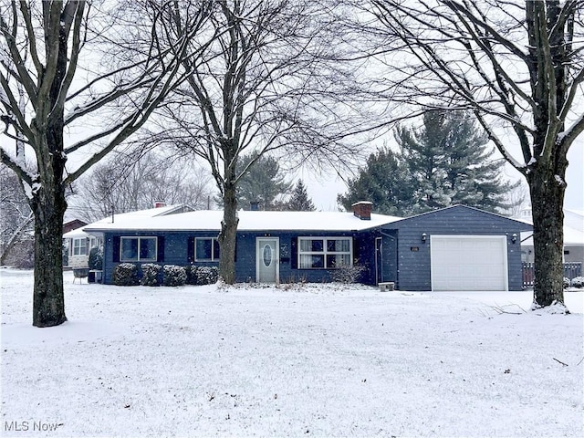 ranch-style home featuring a garage