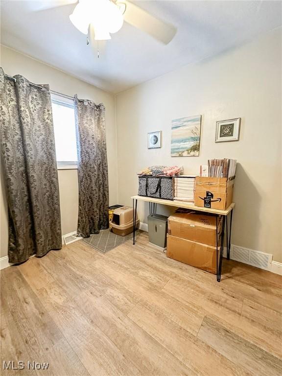 interior space featuring ceiling fan and light wood-type flooring