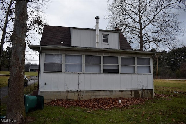 view of home's exterior with a yard