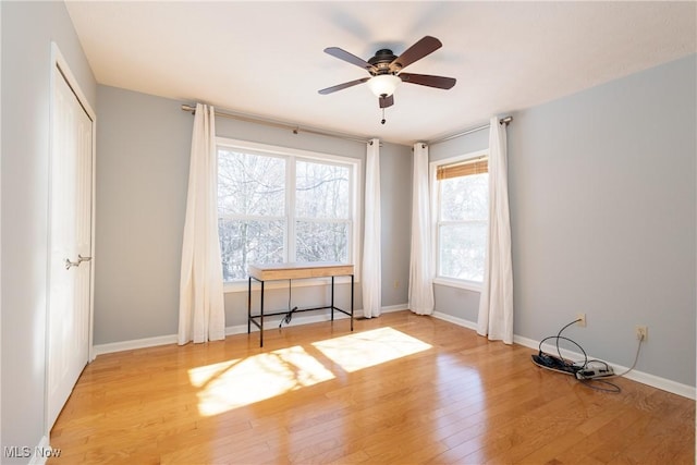 unfurnished room featuring ceiling fan and light wood-type flooring