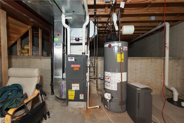 utility room with heating unit and gas water heater