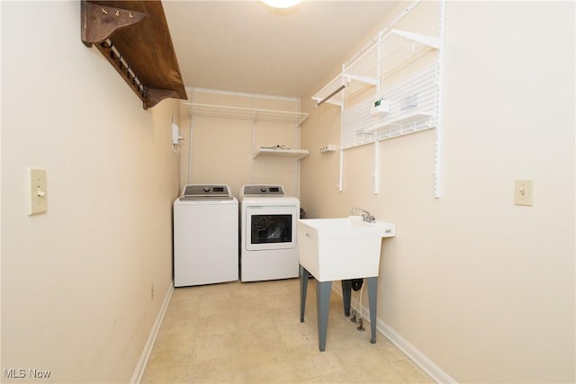 washroom featuring washing machine and clothes dryer