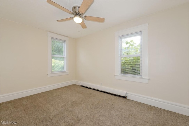 unfurnished room with carpet flooring, ceiling fan, and a baseboard heating unit